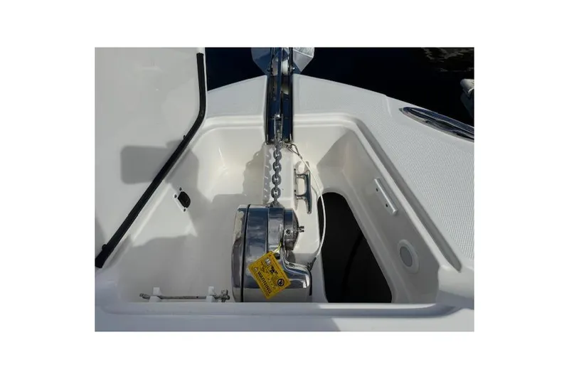 Slide: The Image of Anchor compartment of 2022 Edgewater 280CC boat, featuring a stainless steel windlass. - 14