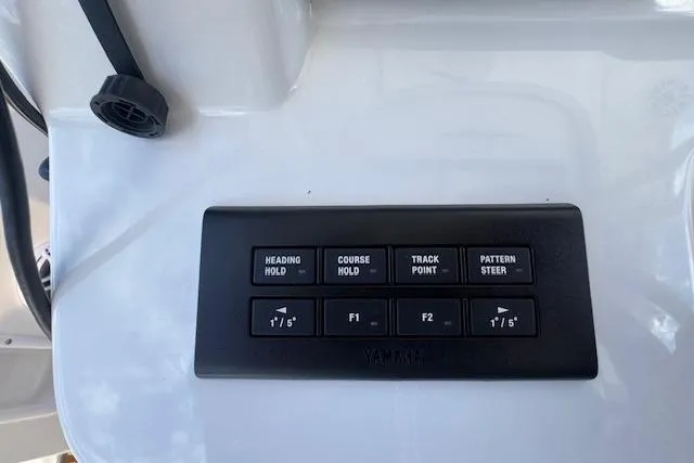 Slide: The Image of Control panel of a 2022 Edgewater 280CC boat with navigation buttons. - 33