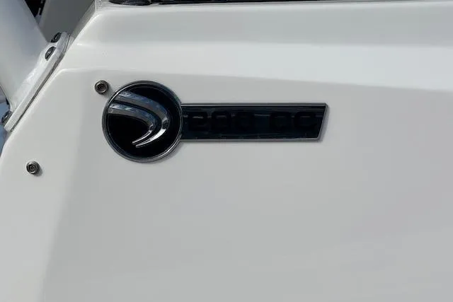 Slide: The Image of Edgewater 280CC 2022 model emblem on a sleek white surface. - 6