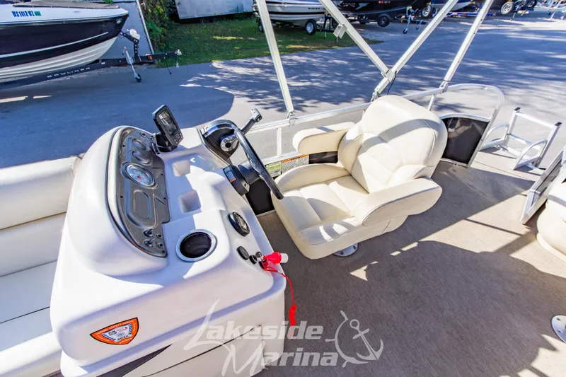 Slide: The Image of 2021 SunChaser Geneva Cruise 20 CRS boat interior with helm and captain's chair. - 16