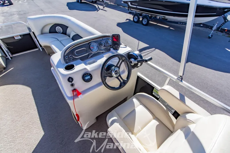 Slide: The Image of 2021 SunChaser Geneva Cruise 20 CRS boat interior with steering console and seating. - 17