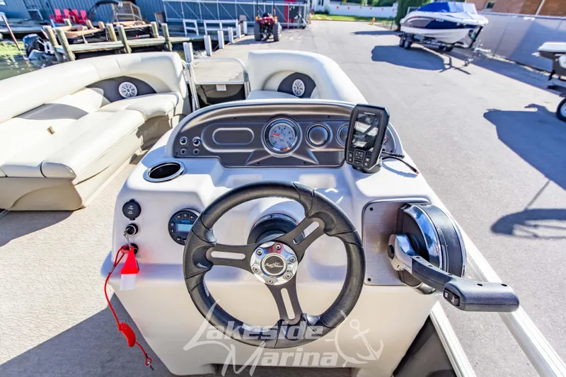 Slide: The Image of 2021 SunChaser Geneva Cruise 20 CRS boat dashboard with steering wheel and controls. - 18