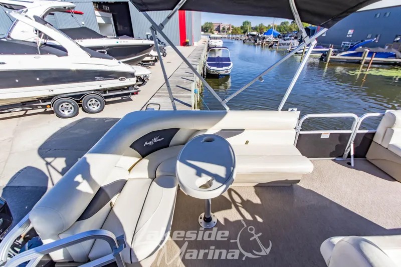 Slide: The Image of 2021 SunChaser Geneva Cruise 20 CRS pontoon boat interior at marina dock. - 20