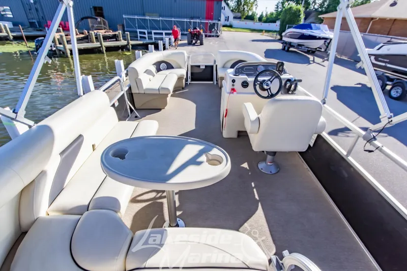 Slide: The Image of 2021 SunChaser Geneva Cruise 20 CRS pontoon boat interior with seating and steering console. - 21