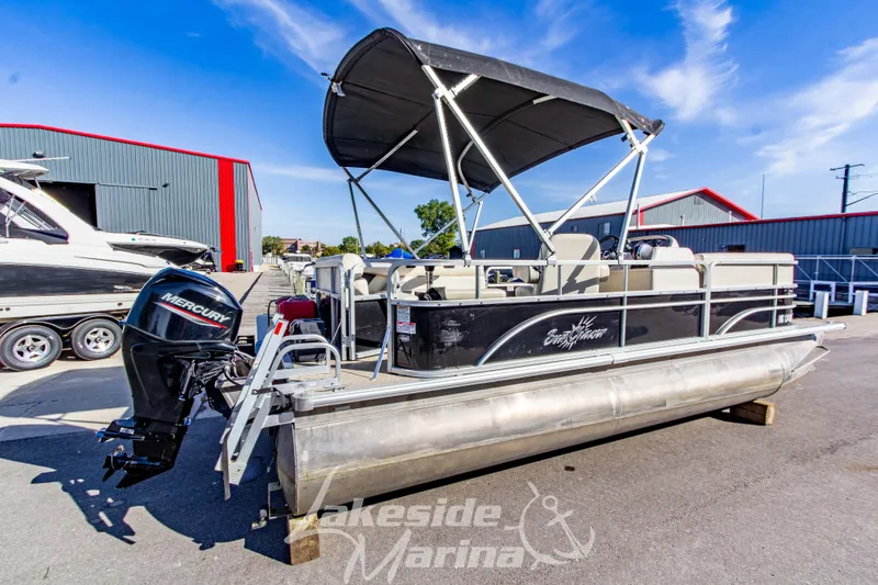 Slide: The Image of 2021 SunChaser Geneva Cruise 20 CRS pontoon boat with Mercury outboard motor at marina. - 5