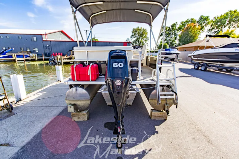 Slide: The Image of 2021 SunChaser Geneva Cruise 20 CRS pontoon boat with Mercury 60 engine at marina dock. - 6