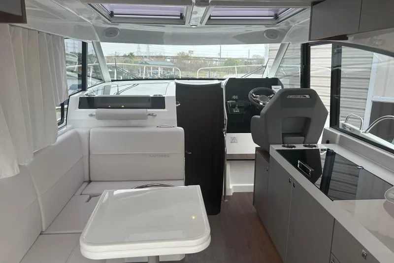 Slide: The Image of 2025 Beneteau Antares 11 Coupe boat detail with logo and seating. - 16