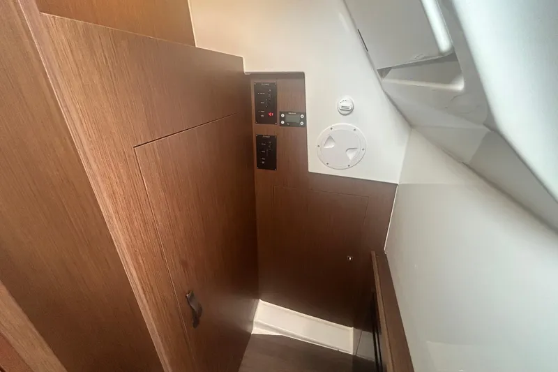 Slide: The Image of 2025 Beneteau Antares 11 Coupe helm with modern steering and control panel. - 26