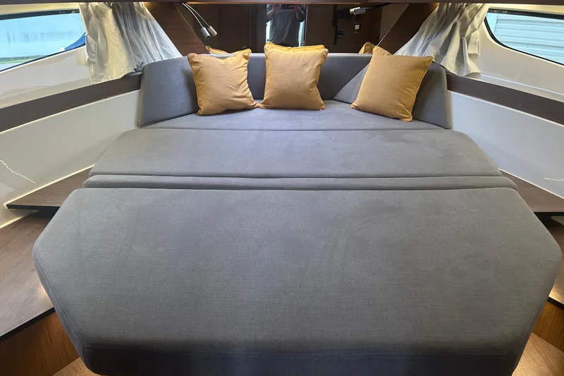 Slide: The Image of Interior of 2025 Beneteau Antares 11 Coupe with boxes and equipment. - 33