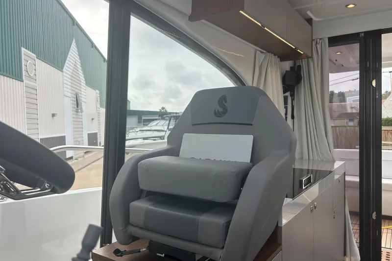 Slide: The Image of Interior of 2025 Beneteau Antares 11 Coupe with seating and table setup. - 34