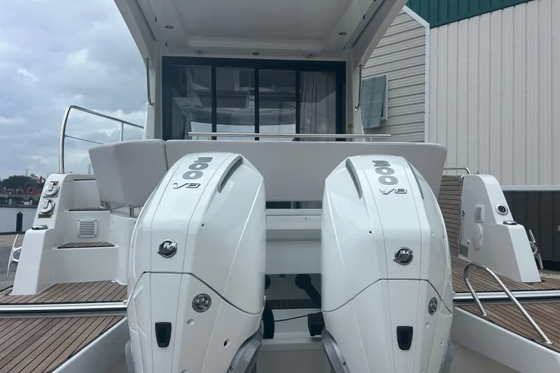 Slide: The Image of 2025 Beneteau Antares 11 Coupe boat on display, featuring sleek design and Mercury engine. - 6