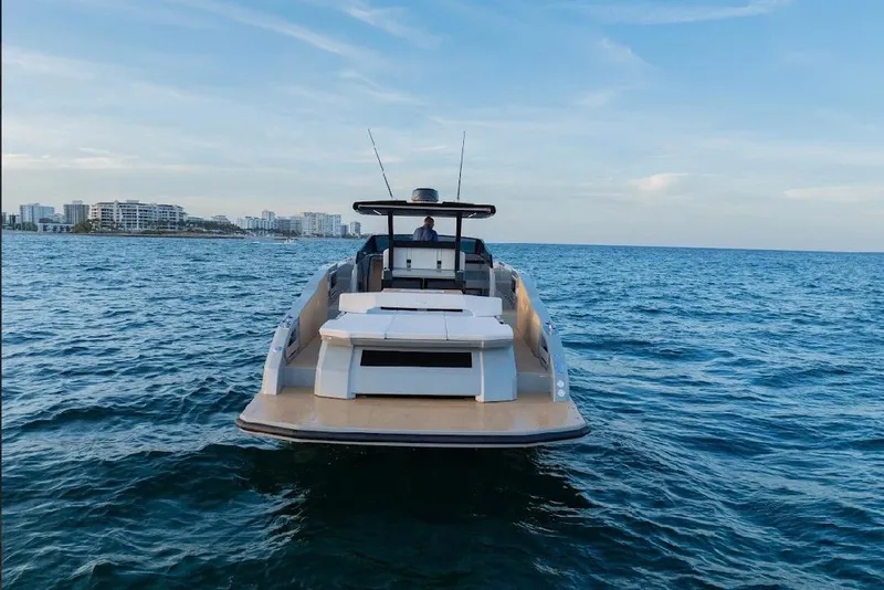 Slide: The Image of 2024 Rio Yachts Daytona 50 on open sea, showcasing sleek design and powerful engines. - 11