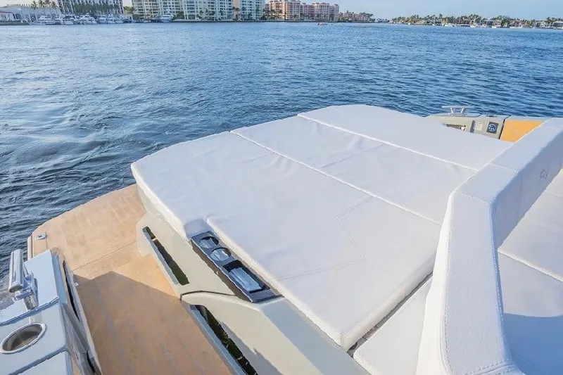 Slide: The Image of 2024 Rio Yachts Daytona 50 luxury deck with scenic waterfront view. - 15
