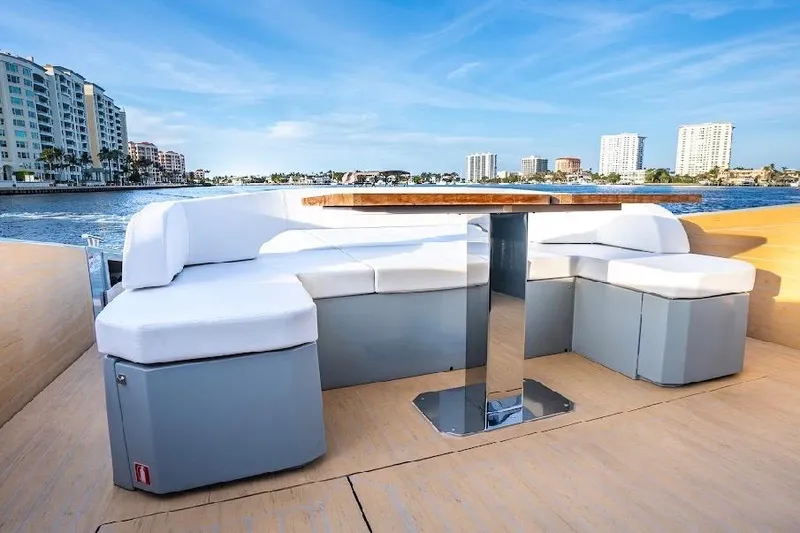 Slide: The Image of Luxurious seating area on 2024 Rio Yachts Daytona 50, with waterfront cityscape view. - 17