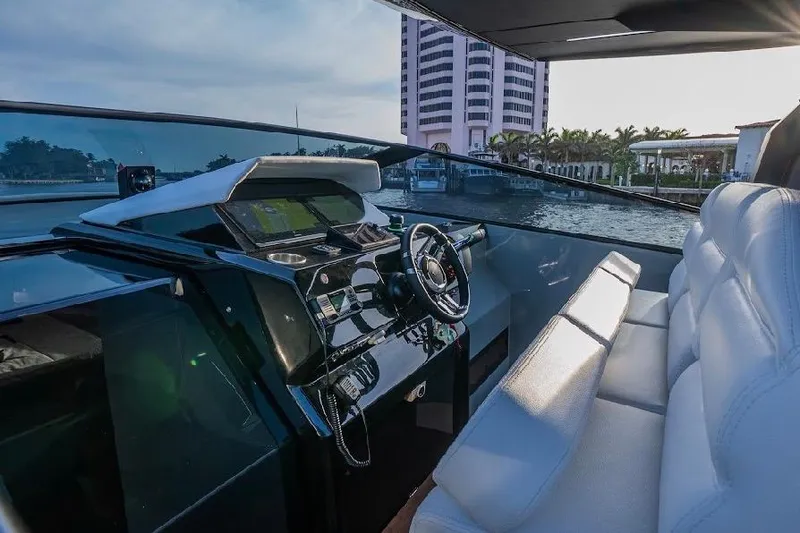 Slide: The Image of 2024 Rio Yachts Daytona 50 cockpit with modern steering and luxurious seating. - 22