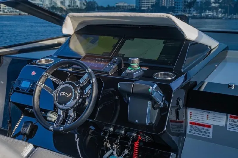 Slide: The Image of 2024 Rio Yachts Daytona 50 helm with modern controls and navigation systems. - 23