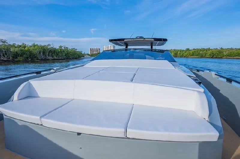 Slide: The Image of 2024 Rio Yachts Daytona 50 luxury yacht with spacious sun deck on serene water. - 26