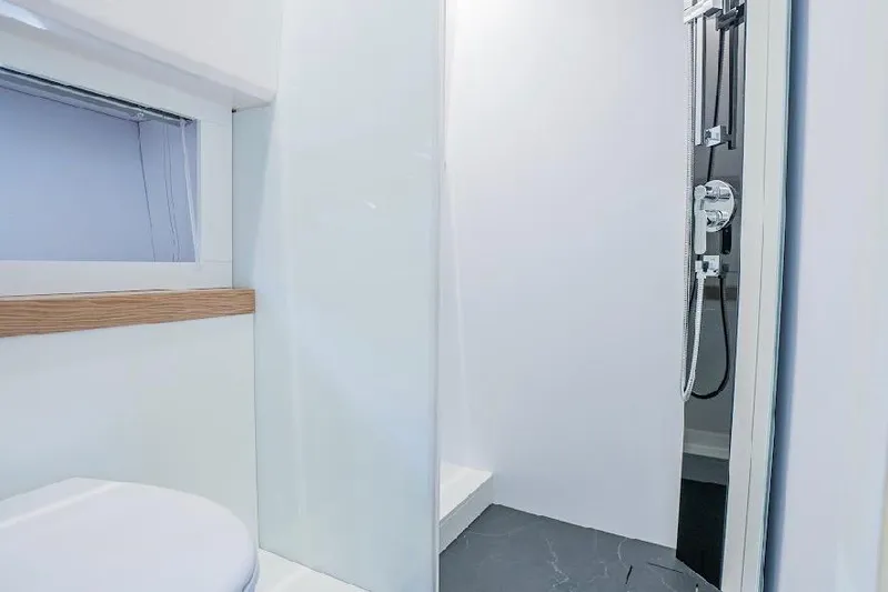 Slide: The Image of Modern bathroom interior on 2024 Rio Yachts Daytona 50, featuring sleek shower and minimalist design. - 32