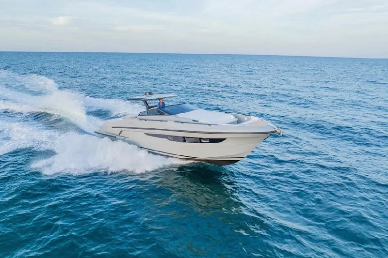Slide: The Image of 2024 Rio Yachts Daytona 50 cruising on open sea, showcasing sleek design and performance. - 5