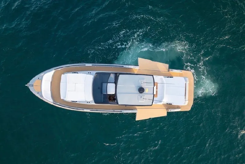 Slide: The Image of 2024 Rio Yachts Daytona 50 cruising on open water, aerial view. - 7