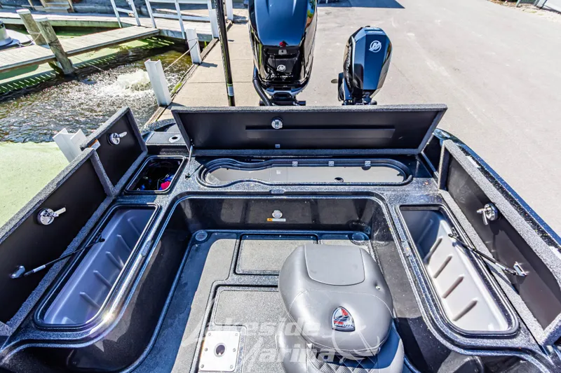 Slide: The Image of 2020 Triton 216 Fishunter boat interior with open storage compartments and seating. - 12