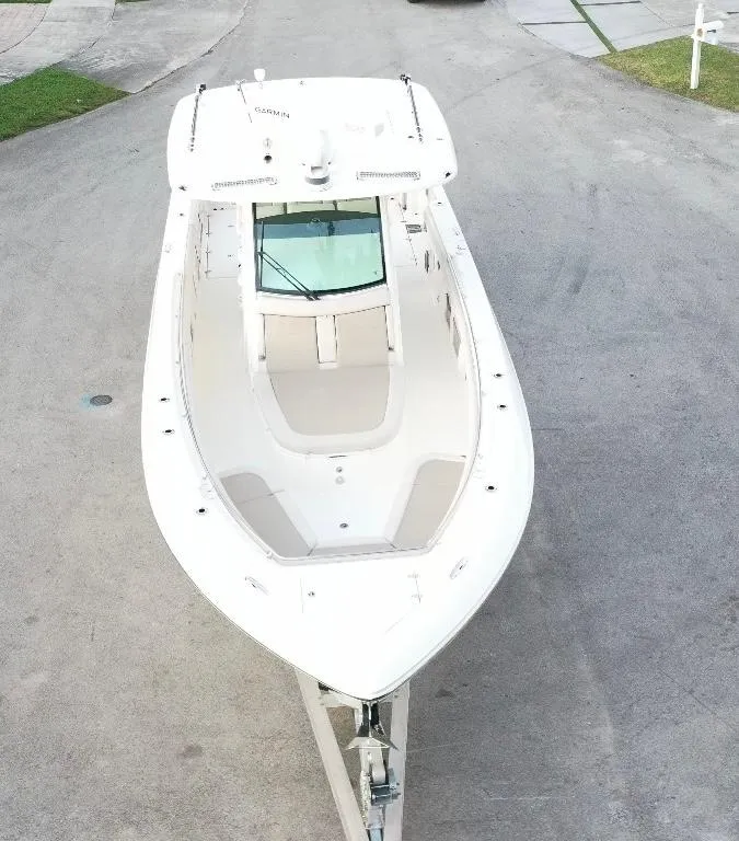 Slide: The Image of 2021 Boston Whaler 350 Outrage boat, aerial view, docked on pavement. - 13