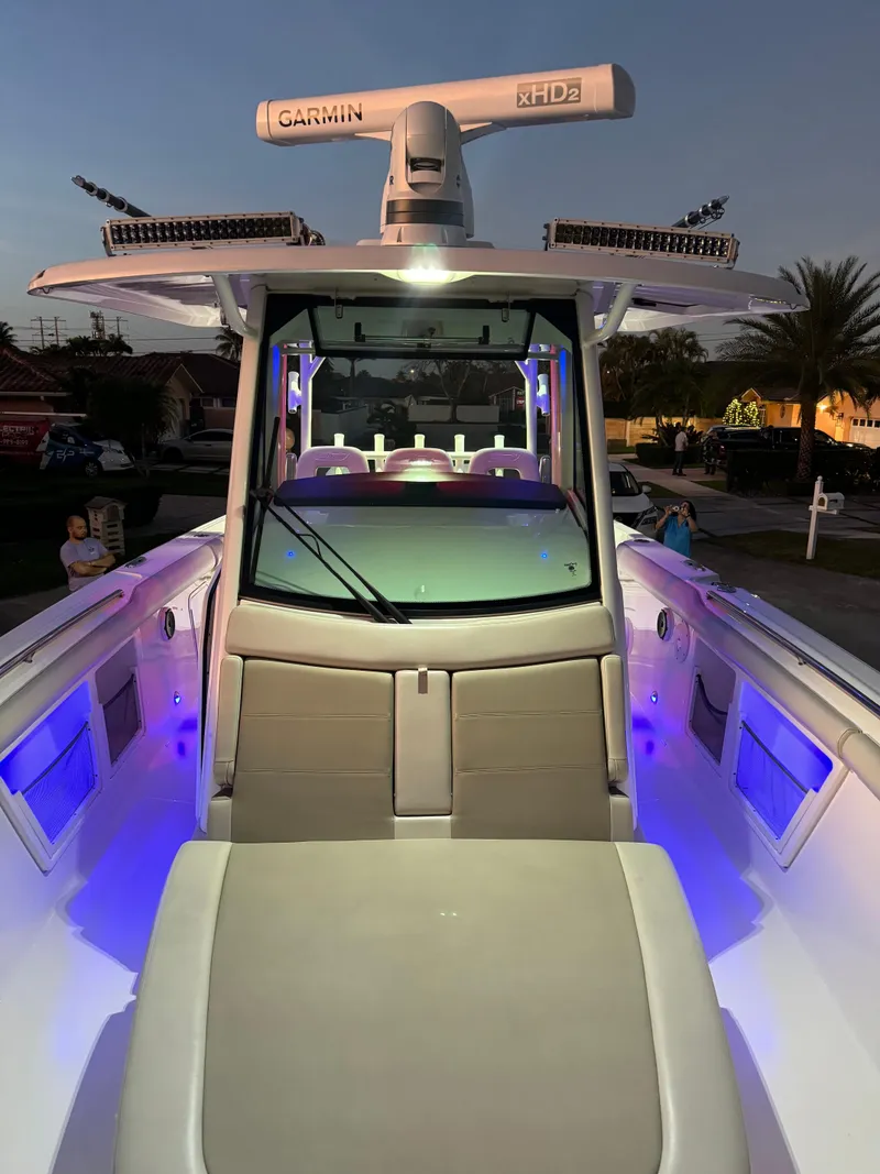 Slide: The Image of 2021 Boston Whaler 350 Outrage boat with illuminated deck and advanced Garmin radar. - 26