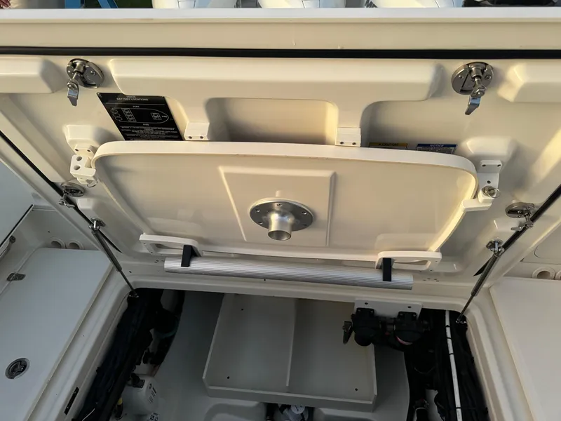 Slide: The Image of 2021 Boston Whaler 350 Outrage storage compartment with open hatch. - 37