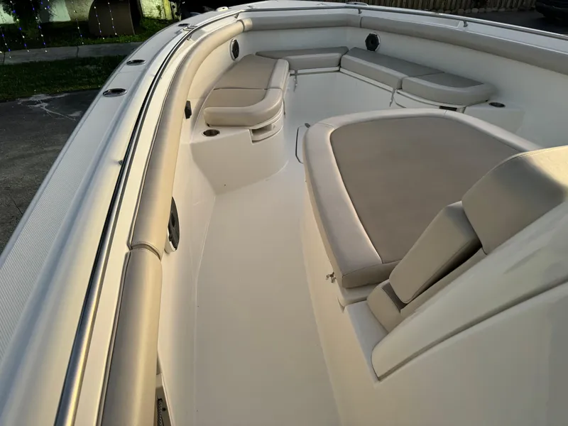 Slide: The Image of 2021 Boston Whaler 350 Outrage boat interior with cushioned seating. - 39