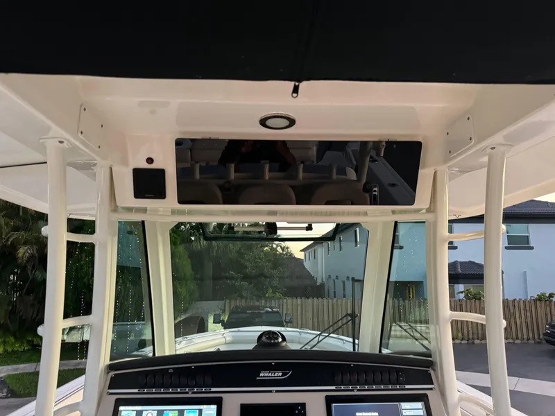 Slide: The Image of Boston Whaler 350 Outrage 2021 helm station with advanced navigation controls. - 42