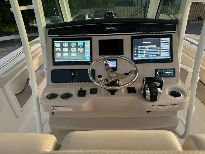Slide: The Image of 2021 Boston Whaler 350 Outrage helm with advanced navigation and control systems. - 43
