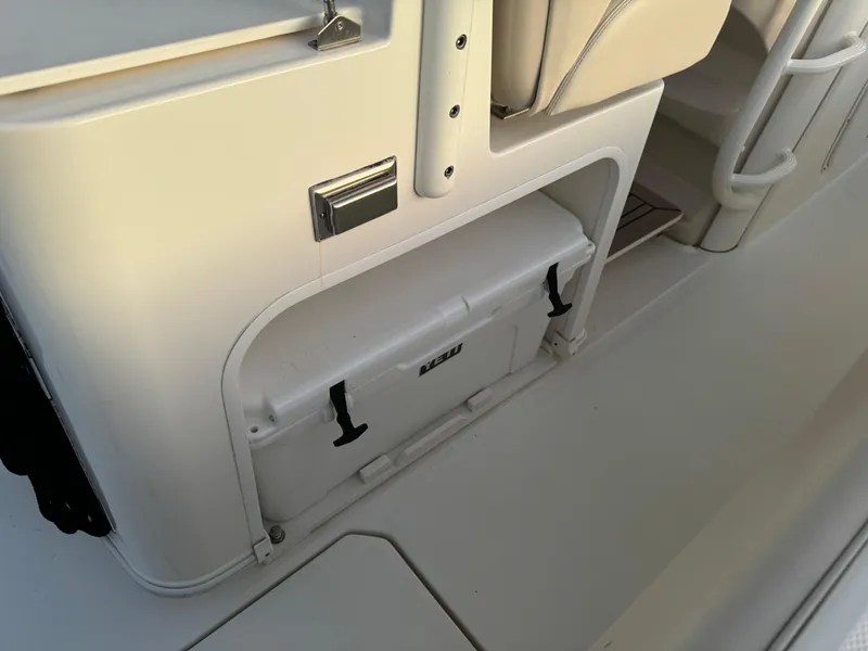 Slide: The Image of 2021 Boston Whaler 350 Outrage boat interior storage compartment with cooler. - 44