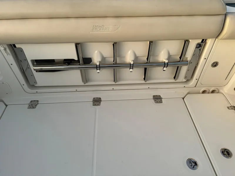 Slide: The Image of Boston Whaler 350 Outrage 2021 boat deck with rod holders and storage compartments. - 45