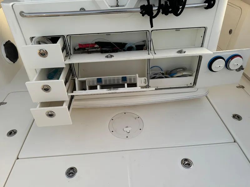 Slide: The Image of 2021 Boston Whaler 350 Outrage fishing tackle storage compartments and drawers. - 46