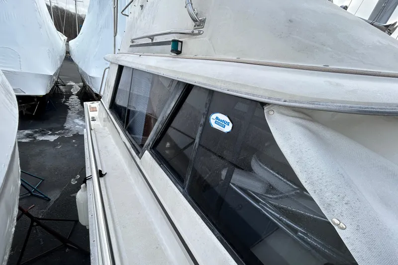 Slide: The Image of 1983 Silverton 34 Convertible boat in storage, covered and winterized. - 18