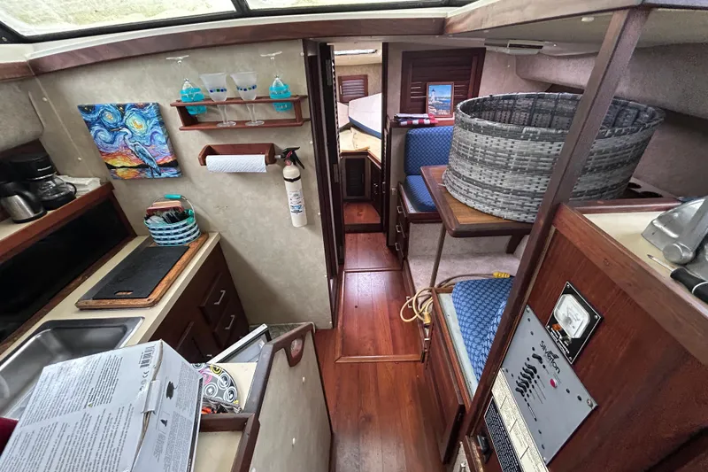 Slide: The Image of 1983 Silverton 34 Convertible interior with kitchen, seating, and decor elements. - 30