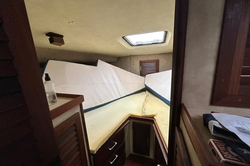 Slide: The Image of Interior cabin of 1983 Silverton 34 Convertible boat with bed and storage. - 37