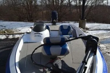 Slide: The Image of 2008 Nitro 640 boat with blue and white seating, parked on snowy ground. - 3