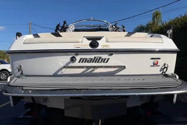 Slide: The Image of 2013 Malibu Wakesetter 24 MXZ boat rear view with swim platform. - 7