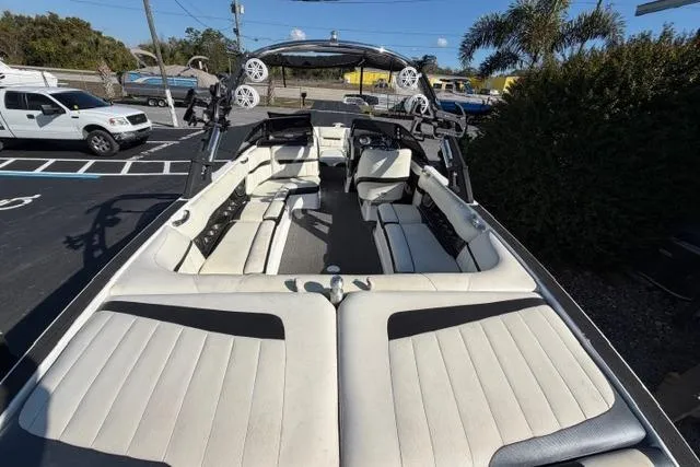 Slide: The Image of 2013 Malibu Wakesetter 24 MXZ boat with spacious seating and sleek design. - 9