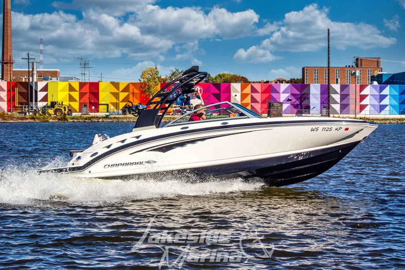The Image of 2017 Chaparral 244 Sunesta boat cruising on water, colorful mural background. - 1