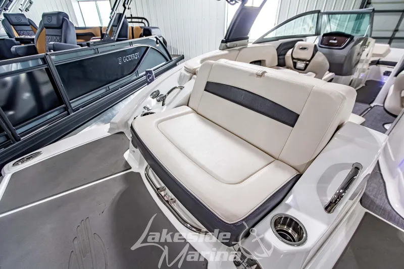 Slide: The Image of 2017 Chaparral 244 Sunesta boat interior with comfortable seating and modern design. - 11