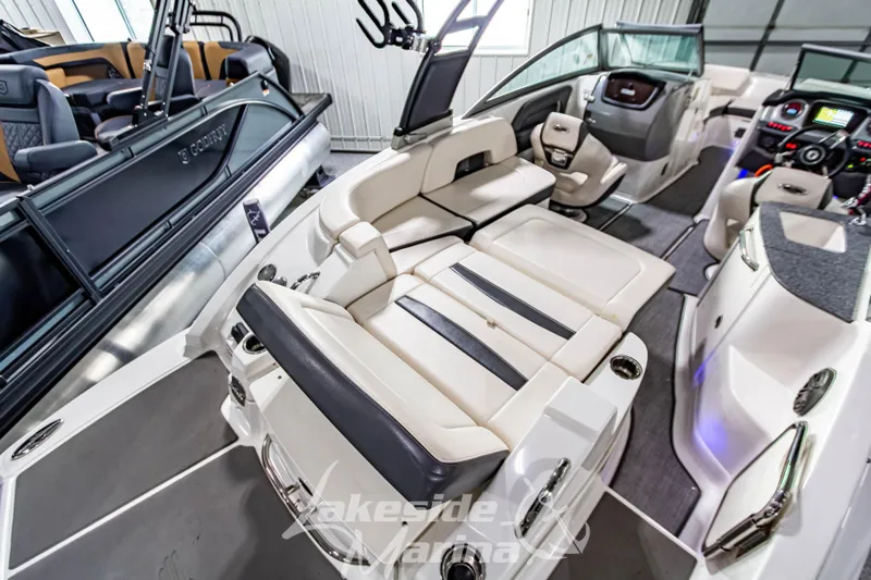 Slide: The Image of 2017 Chaparral 244 Sunesta boat interior with luxurious seating and modern dashboard. - 13