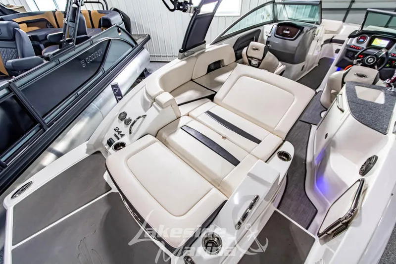 Slide: The Image of 2017 Chaparral 244 Sunesta boat interior with luxurious seating and modern dashboard. - 14