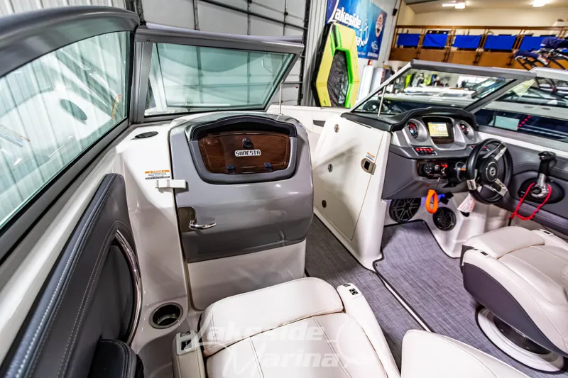 Slide: The Image of 2017 Chaparral 244 Sunesta boat interior with modern dashboard and seating. - 27