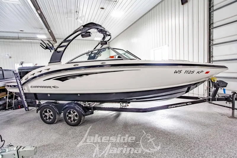 Slide: The Image of 2017 Chaparral 244 Sunesta boat on trailer in indoor storage facility. - 3