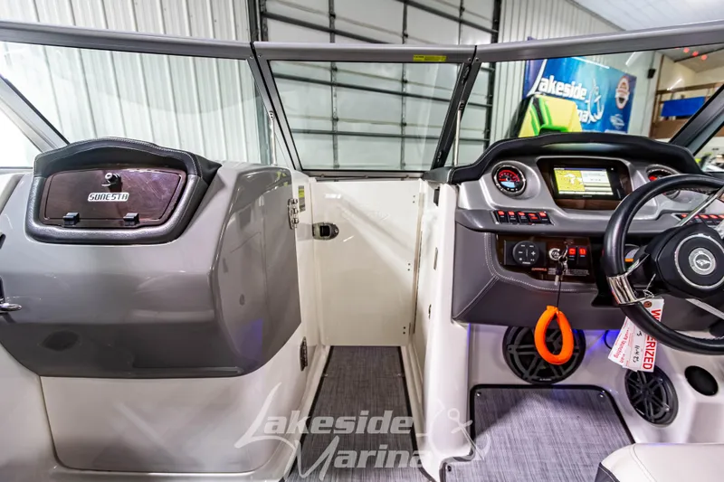Slide: The Image of 2017 Chaparral 244 Sunesta boat interior with dashboard and steering wheel at Lakeside Marina. - 31