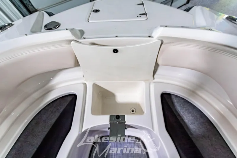 Slide: The Image of 2017 Chaparral 244 Sunesta boat interior with storage compartment, Lakeside Marina branding. - 38