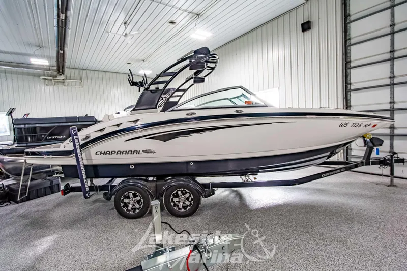 Slide: The Image of 2017 Chaparral 244 Sunesta boat on trailer in indoor storage facility. - 4