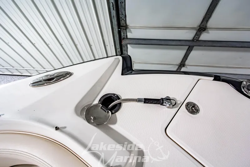 Slide: The Image of 2017 Chaparral 244 Sunesta boat deck with fuel cap and storage compartment. - 42